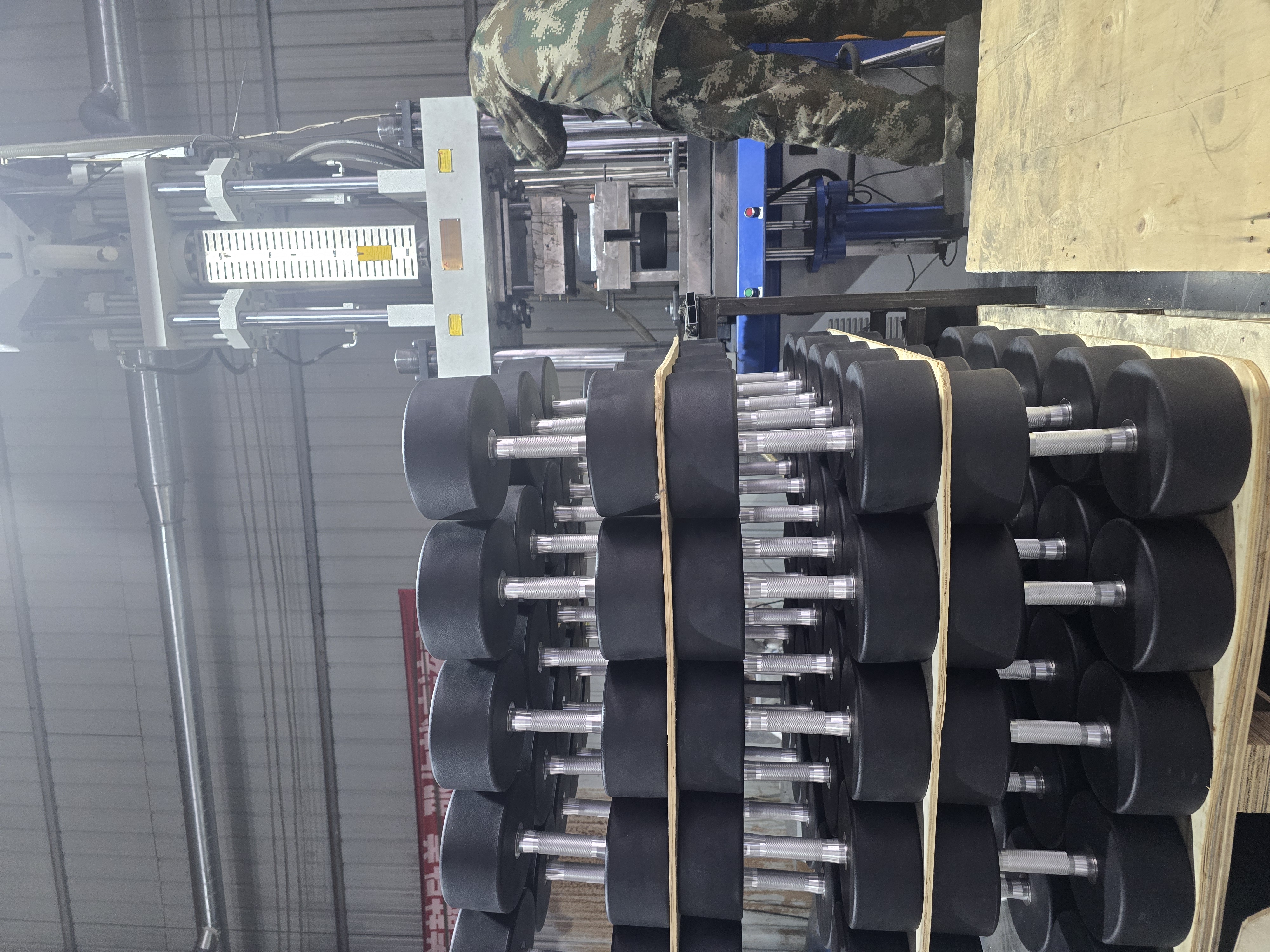 Finished dumbbells arranged in factory production area