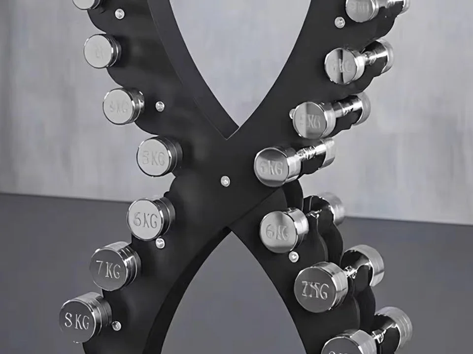 Close view of kilogram markings and chrome dumbbell supports on the compact rack