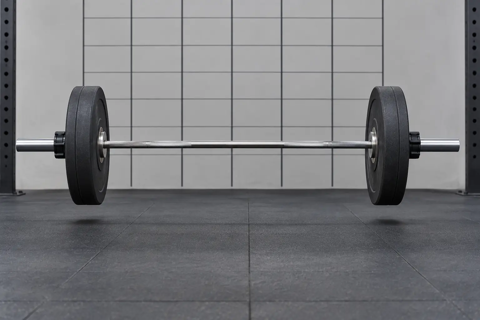 Unbranded Olympic barbell with bumper plates above a rubber platform during rebound comparison